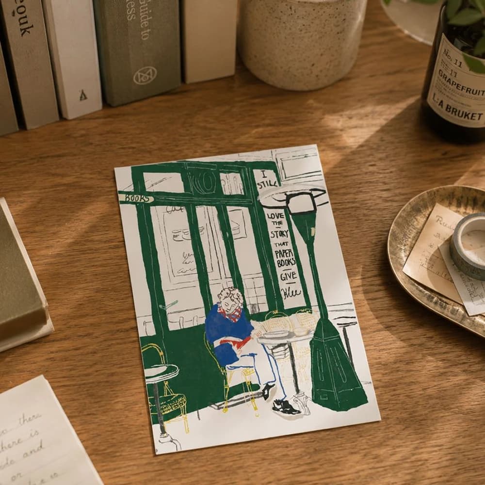 a reading man postcard